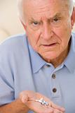 Senior Man Holding Prescription Drugs