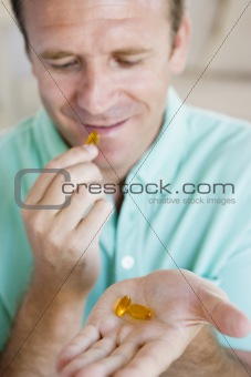 Man Taking Pills