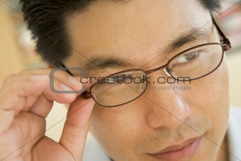 Man Looking Through New Glasses