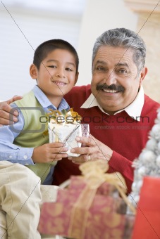 Boy Surprising Father With Christmas Present