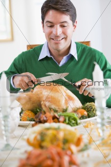 Man Excitedly Carving A Turkey