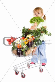 Little girl shopping vegetables
