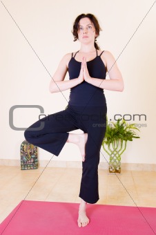Beautiful young lady doing yoga