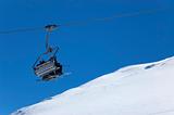 Chair lift at ski resort. Winter vacations