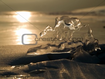 beautiful piece of ice against the sunset