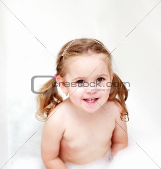 Small girl in bath tube