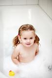 Small girl in bath tube