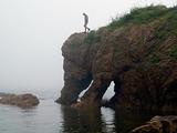 young man on the foggy elephant rock  