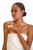 Black girl with soap bar wrapped in white bath towel