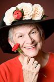 Senior woman in a hat with flowers