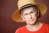 Senior woman in a straw hat