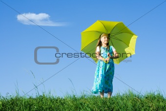 Girl at meadow with umbrella