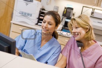 Nurses At The Reception Area In A Hospital