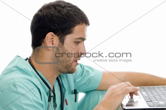 doctor with laptop looking you