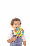 shot of a child licking a lollipop