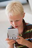 Boy playing on a game console