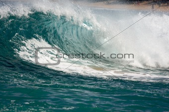 Dramatic Shorebreak Wave on a clear morning.