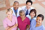 High Angle View Of Hospital Staff Standing Outside A Hospital