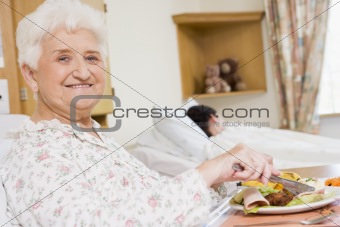Young Woman Eating Hospital Food