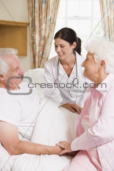 Doctor Talking To Senior Man And His Wife