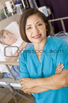 Doctor Standing With Arms Crossed In Her Patients Room 