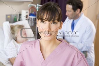 Nurse Standing In Hospital Room,Doctor Talking With Patient