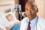 Doctor Looking Serious In Hospital Room,Senior Woman Lying In Ho