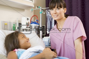 Nurse Checking Up On Young Patient