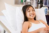 Young Girl Smiling In Hospital Bed