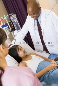 Doctor Talking To Young Girl