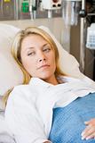 Woman Lying In Hospital Bed