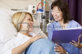 Pregnant Woman Talking To Doctor