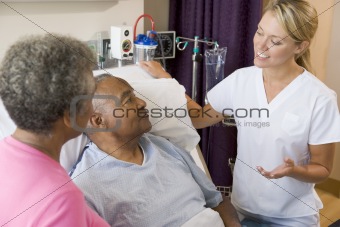 Doctor Explaining To Senior Couple