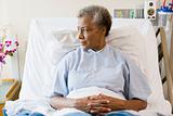 Senior Woman Sitting In Hospital Bed