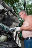 The man repairs car
