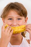 little girl eating banana