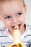 healthy boy eating banana