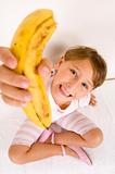 little girl showing you banana
