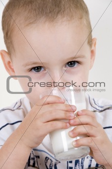 little child with milk glass