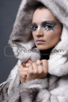 Woman in white fur.