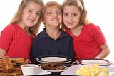 shot of Three young children at breakfast