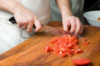 chopping the tomato