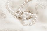 Wedding background: pearls and wedding bangs. Toning in sepia.
