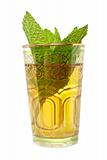 Glass cup of tea with leaves of mint