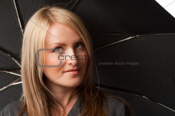 Girl holding black umbrella, isolated