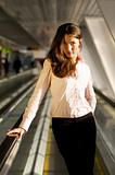 Businesswoman on a moving walkway
