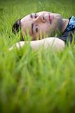 portrait of a relaxing in the green grass
