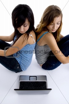 girls looking to laptop