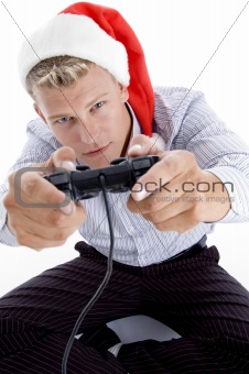 caucasian man with remote and christmas hat