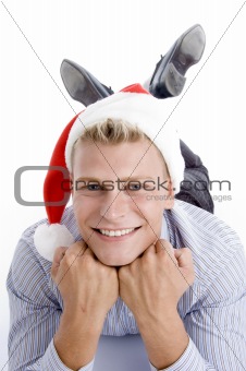 happy laying man with christmas hat